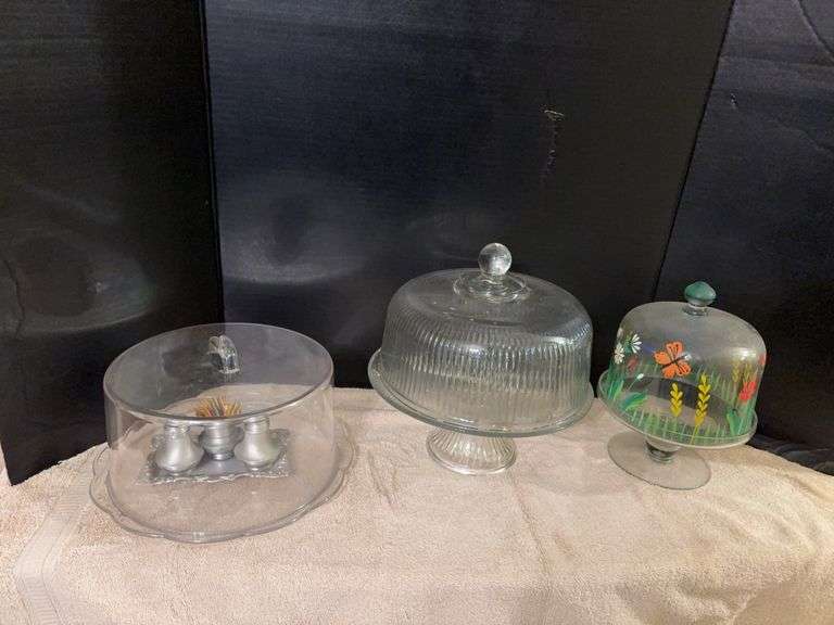 Two glass cake stands w covers, plastic covered platter and S&P shakers w toothpick holder and tray image