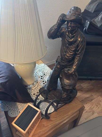 Plaster cowboy sculpture, Louis LaMoure book on cassette