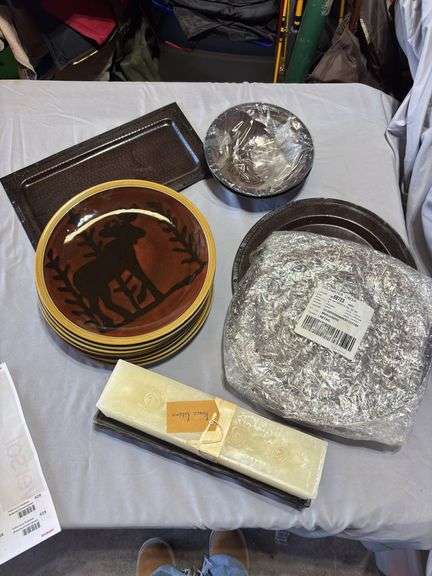 Metal chargers and moose dishes with large candle