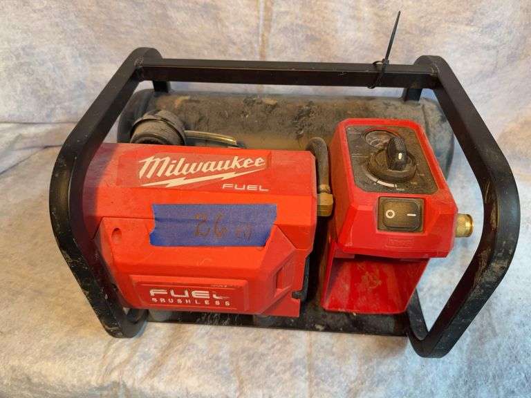 Milwaukee battery operated compressor runs on various batteries. No batteries, not tested. image