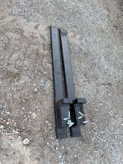 Non-adjustable clip-on pallet fork	WOLVERINE TF2-66-4000G	"Applicable products include tractor accessories, skid steer loaders, and loader buckets Scope of application: Transport logs, timber, and firewood, and move fence posts, hay bales, clear debris, and shrubs Right angle bolt size： (M12x1.75) × 150mm Hexagonal flange with gasket flower tooth flange nut： M12x1.75" image