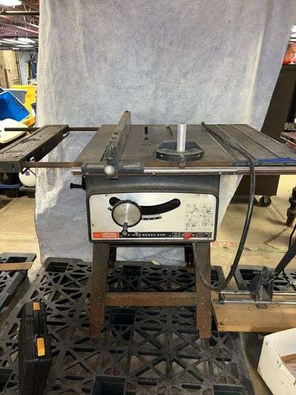 Craftsman table saw on stand with fence, miter gauge, extra 60 tooth blade, dado set, molding set. Chicago electric oscillating tool. image