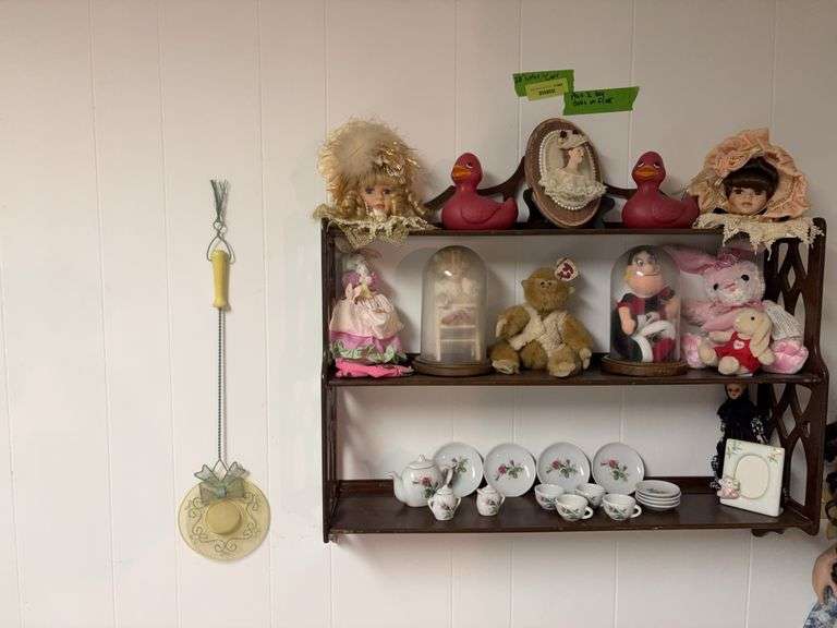 28” long wall shelf and contents plus two frilly dolls sitting on the floor image