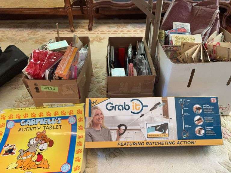 Misc items include playing cards, tablecloth cards, holiday paper items, coin holders, Garfield activity book, etc