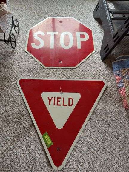 Two road signs “STOP” and “YIELD” image