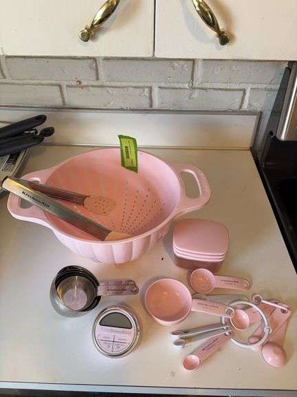 KitchenAid kitchen items includes timer, strainer, tongs, measuring cups image