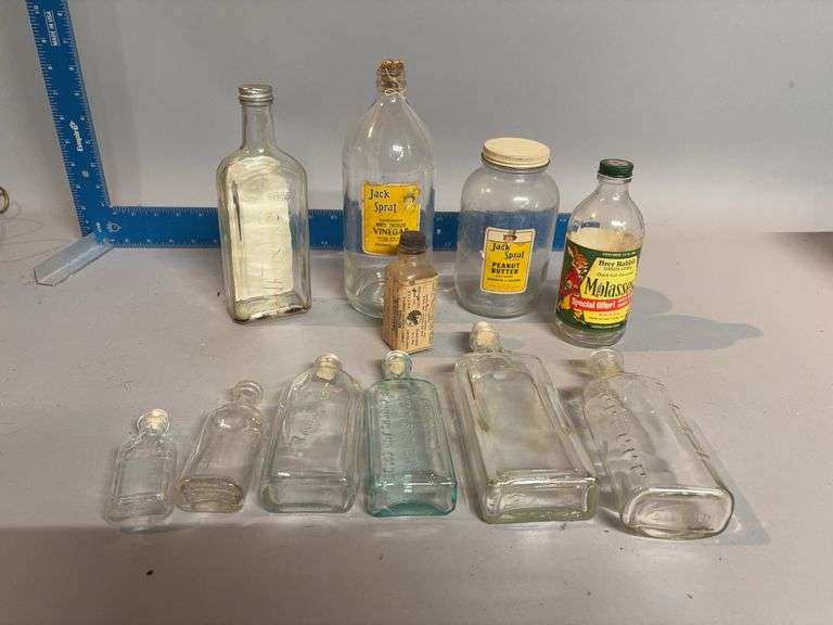 Old glass bottles including Jack Spratt and Watkins image