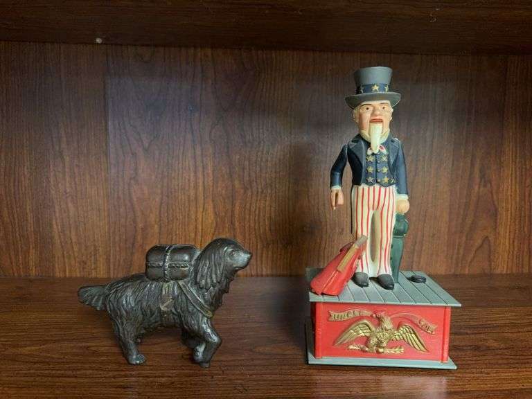 Plastic Uncle Sam bank, needs repair, and cast iron dog penny bank