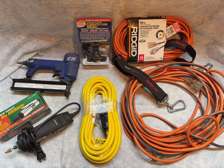 Miscellaneous lot with 25 ft 12 gauge extension cord, two 50-ft 14 gauge extension cords, floor squeak eliminator tool, Dremel 3000 variable speed grinder, Campbell Hausfield 1/4-In air dye grinder. image