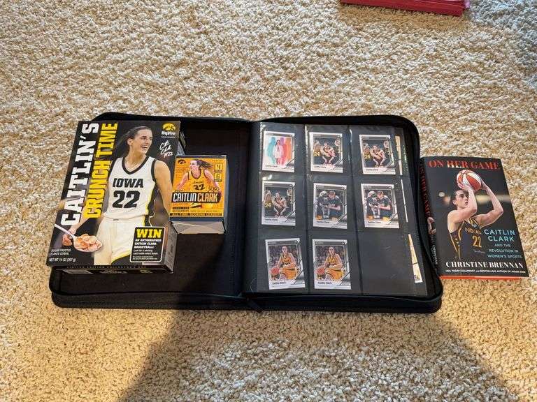 Caitlin Clark trading cards, empty boxes and book image