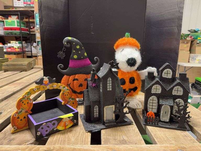 Halloween decor includes tinsel Snoopy, light up houses, treat tray and metal pumpkin image