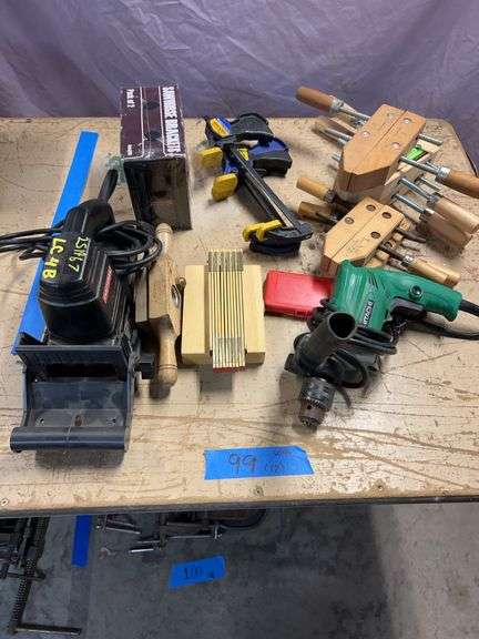 Craftsman biscuit (plate) joint joiner, tenon threader, seven-piece forstner bit set, 6-ft folding Lufkin ruler, five wood screw clamps, three 6-in Quick Grip clamps. image