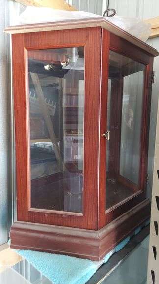 Display case, mirror backed, glass shelf included, lighted but untested (worked last time it was used long ago), 29.5"H x 28"W(back)/16"W(front) x 10.5"D image