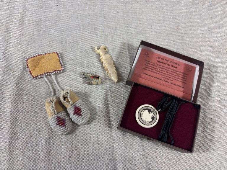 Two bone fetish pendants, beaded leather moccasin brooch, and ceramic pendant necklace image