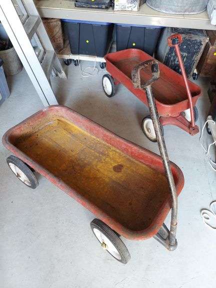 Two red coaster wagons image