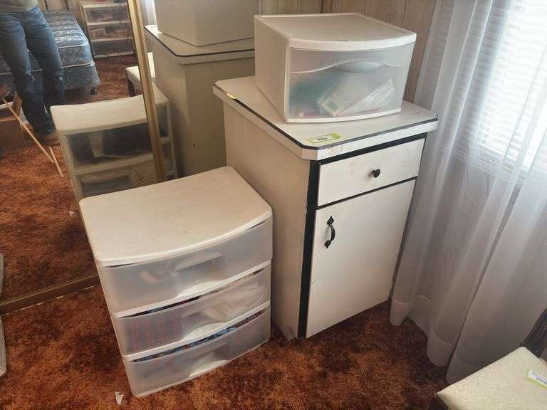 Storage drawer full of fabric, plus wooden cupboard image