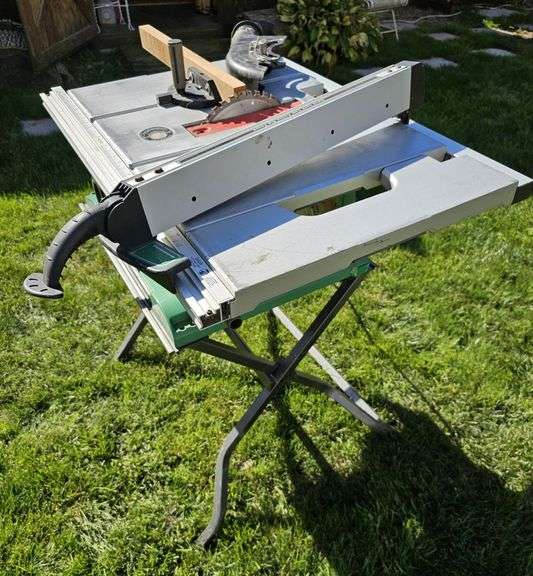 Hitachi C10RA3 15-amp 10-inch Benchtop Table Saw with Stand. Tablesaw unit (not including legs): 23"L x 33"W x 11.5"H. Foldable legs dimensions: approx. 2' x 2' x 2' unfolded. WORKS GREAT! image