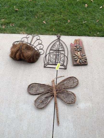 Metal wall baskets, rock art and butterfly image
