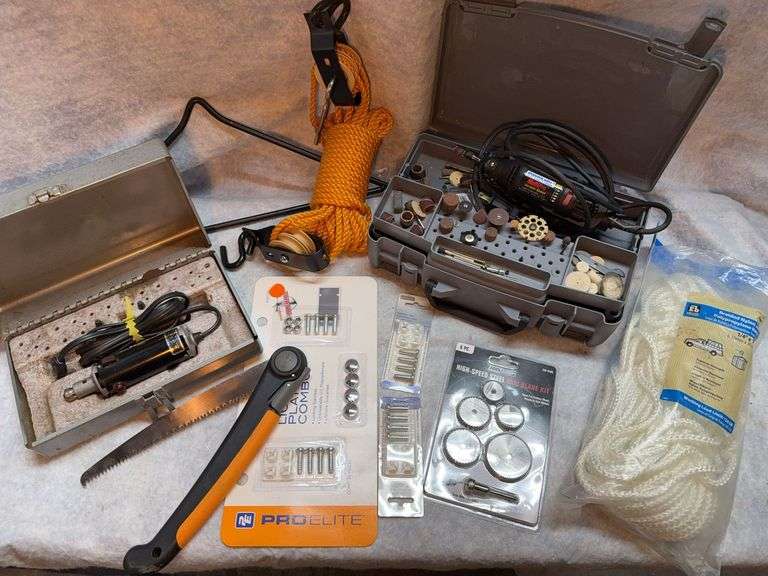 Miscellaneous lot with Dremel variable speed grinder, accessory box, high-speed steel saw blade kit, braided nylon and propylene rope, 100 ft by 1/4-in, deluxe gambrell and hoist, fiskars folding limb saw with 8-in blade, pro electric chrome license plate kit. image