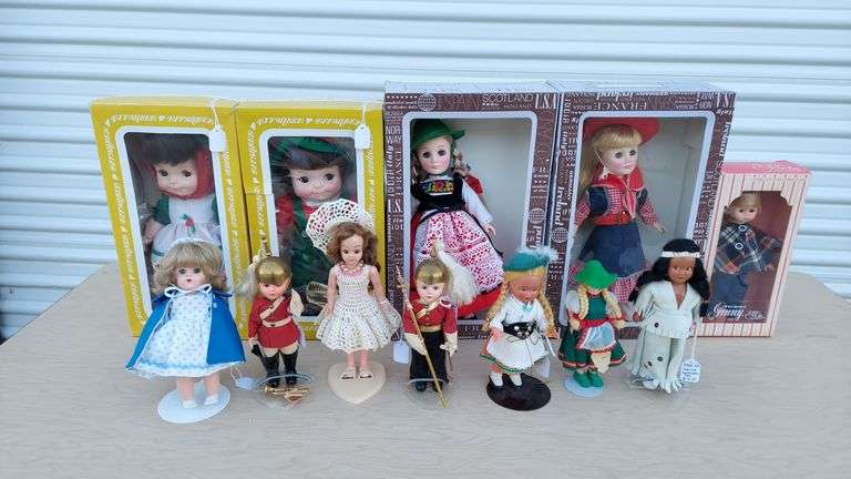 Dolls (some in boxes), accessories, doll-sized rocking horse, rocker crib cradle bed, tea playset image
