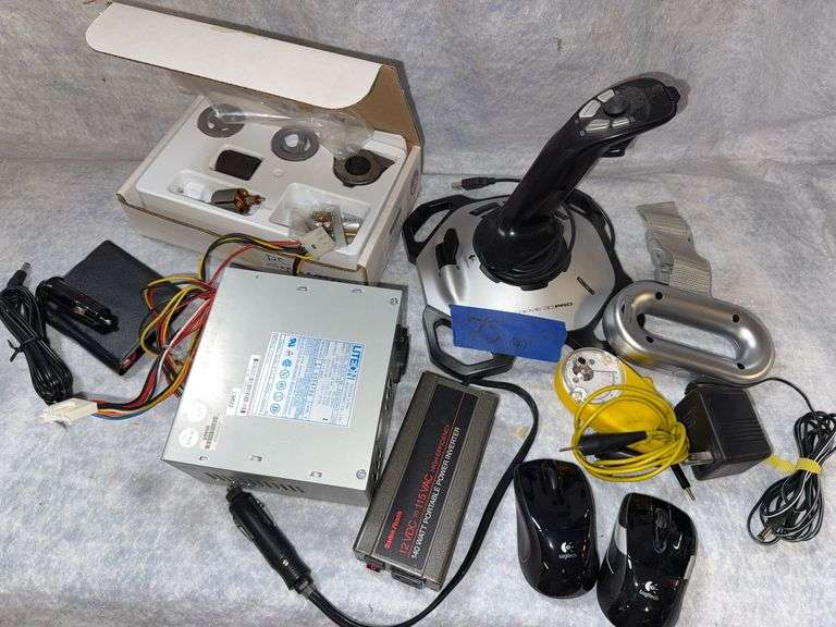 Logitech extreme 3D pro gaming joystick. Radio Shack 12 volt DC to 115 volt AC power inverter 140 w. Amprobe AC voltmeter with clip-on ammeter, pocket digital multimeter, DC generator kit, miscellaneous electrical items. image