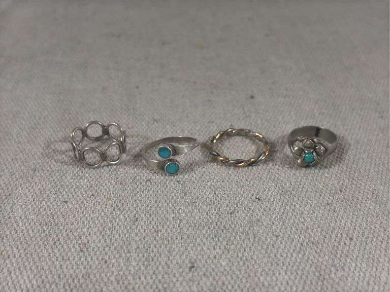Four unmarked rings 5.9 g total weight image