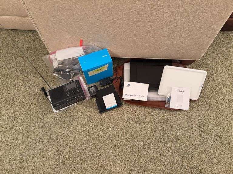 Anker wireless charging dock, Sangean weather radio, Memory  Frame digital picture frames and miroco light therapy lamp image