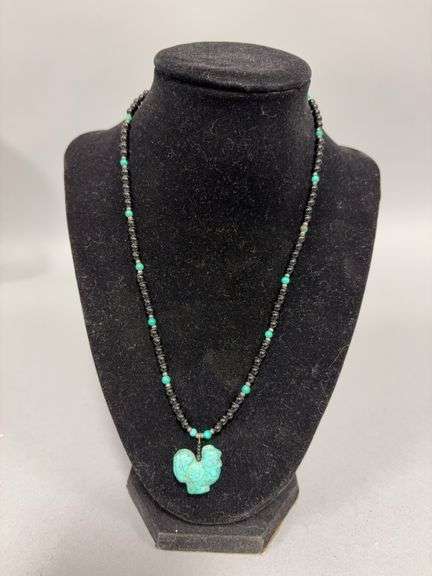 Turquoise chicken pendant , black beaded 17” necklace image