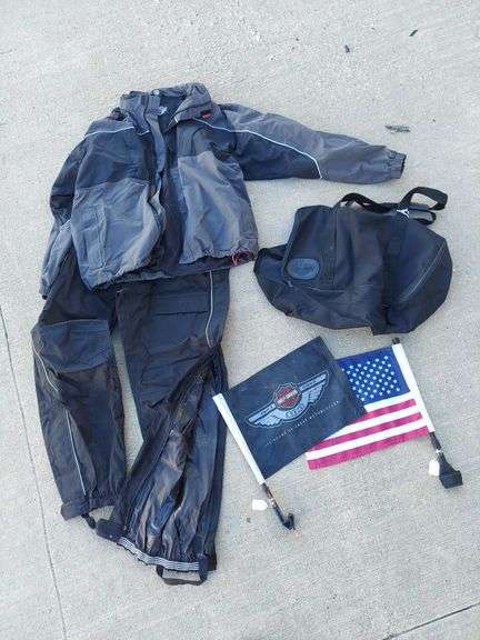 Harley Davidson collectibles and motorcycle parts. HD rainsuit men's size XL (jacket & pants), HD duffel bag, HD & USA bike flags, 1 generic motorcycle cover, 1 Nelson-Rigg waterproof motorcycle cover (fits Electra Glide), vintage chopper back rest, and more! image
