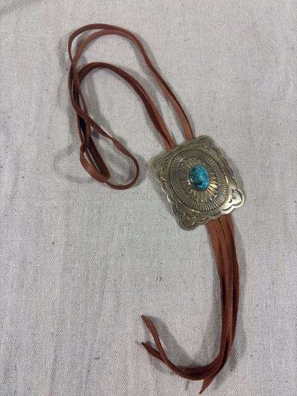 Unmarked stamped bolo slide on leather image