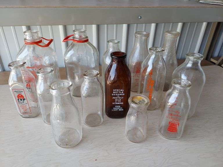 Milk bottles, carriers, soda beer whiskey bottles, medicine bottles image