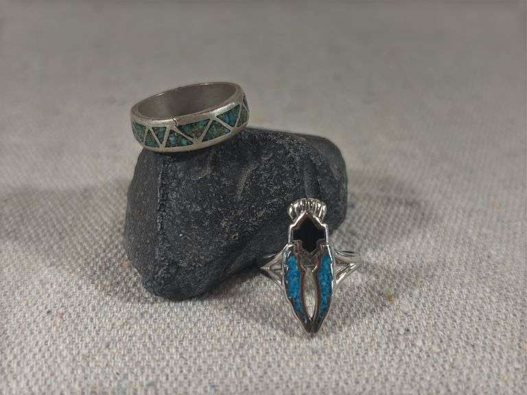 Two rings one size 6 with crushed turquoise and black inlay and unmarked band size 8 with crushed inlaid turquoise 8.8 g total weight image