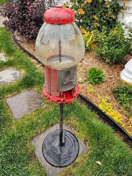 Gumball machine, Base says Curtis, metal & glass machine approx 15"H, overall stands approx 48"H, needs cleaning image
