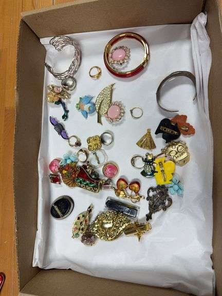 Costume jewelry includes rings, bracelets, brooches image