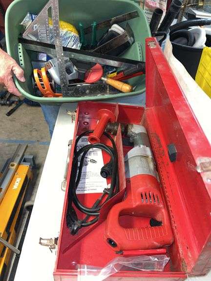 Milwaukee heavy duty right angle drill, 14-in bolt cutter, tub of miscellaneous hand tools, router bits, stapler and Staples, wrenches, block plane. image