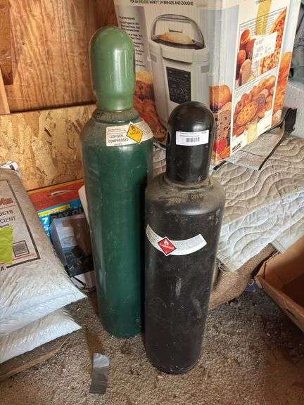 Small oxy and acetylene tanks - seem to be full image