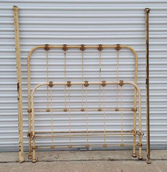 Antique iron bed frame with headboard and footboard (fits "full" size mattress). 2 original steel rails lock into HB & FB for easy assembly. Cream-colored finish with gold accents; finish is chipped but has never been painted over (original factory finish). Overall GOOD antique condition, all intact with no major damage or missing parts. Would make a great restoration project!  Headboard dimensions: 56"H x 54"W; Footboard dimensions: 40"H x 54"W image
