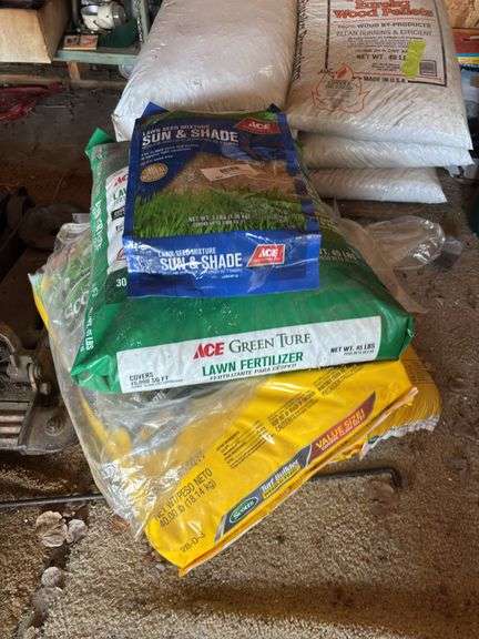 Lawn fertilizer, weed and feed, grass seed image