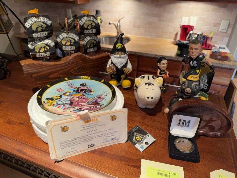 Iowa Hawkeyes collectibles group-Claire Till, George Kittle bobbleheads, Gary Patterson collector plate, coin, bank, gnome image