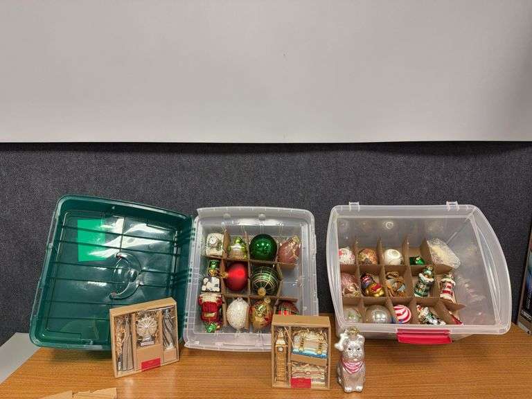 Two holiday ornament cases with ornaments image