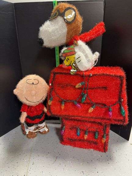 Tinsel type Charlie Brown (missing mask) approx 19” tall and Snoopy as the Red Baron approx 34” tall image