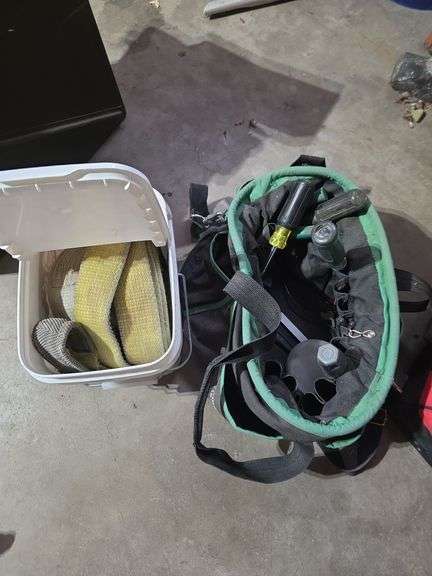 Tool bag with some tools and bucket with tow straps image