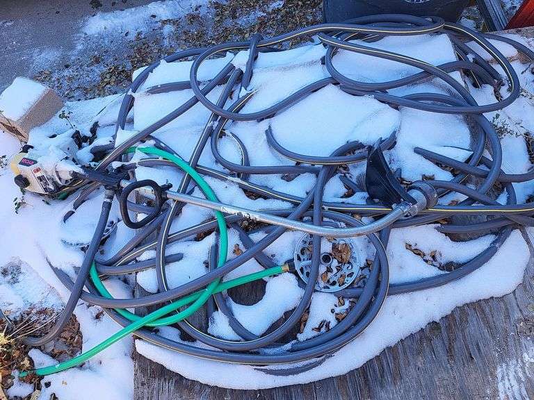 Garden hose, trash cans, weed eater, traps image