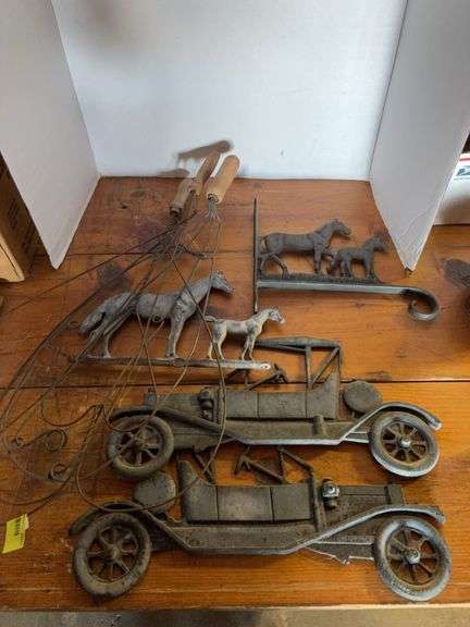 Two rug beaters, two cast iron cars, cast iron horse hanger and metal horse rail mount image