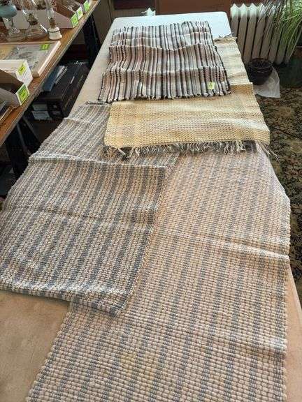 Four woven rugs image
