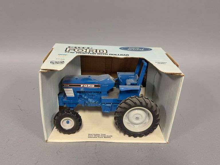 1:16 scale Ertl Ford 7710 tractor with rollbar image