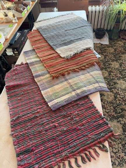 Four woven rugs image
