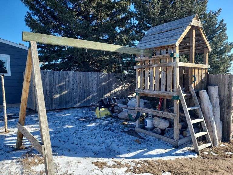 Swing set/tree house (buyer is responsible for moving-may need to unassemble-Buyer can back up to it, but it is up a hill you may need 4-wheel drive if snowy) image