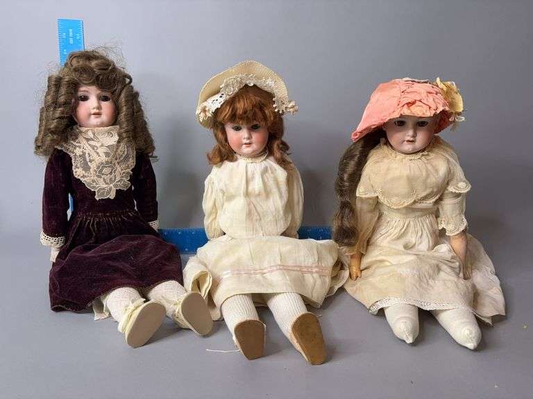 Three bisque dolls, two with sleep eyes image