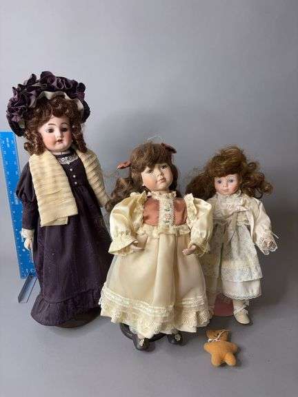 Three bisque dolls image